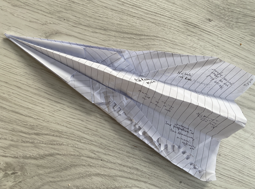 Paper plane with compliments